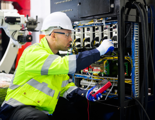 Expert electrician performing electrical repair services in Riyadh