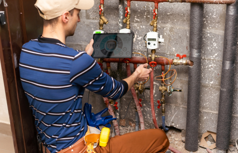 Technician installing a sump pump in Riyadh